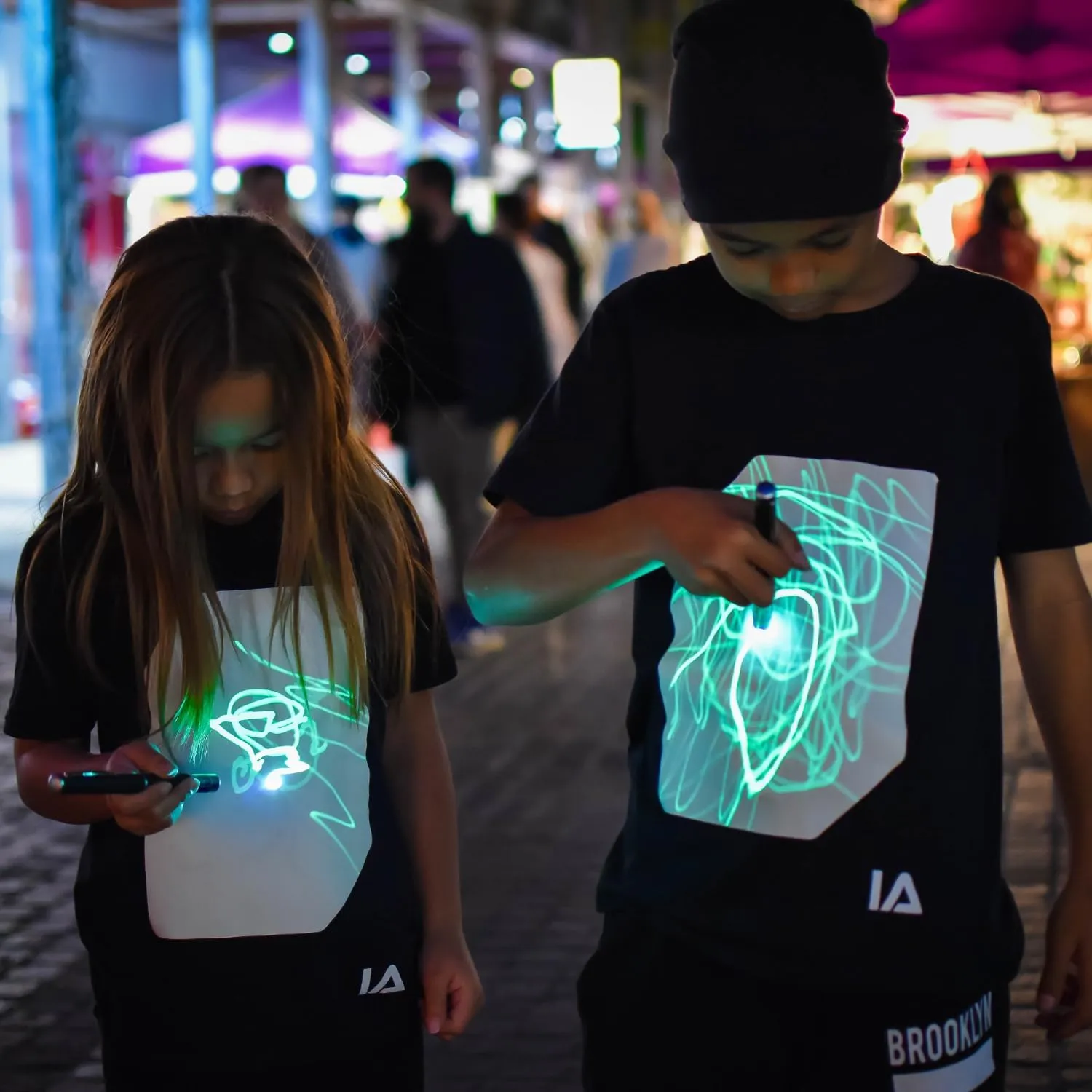 Illuminated Apparel Original Interactive Glow in The Dark T-Shirt - Fun for Birthday Parties & Festivals
