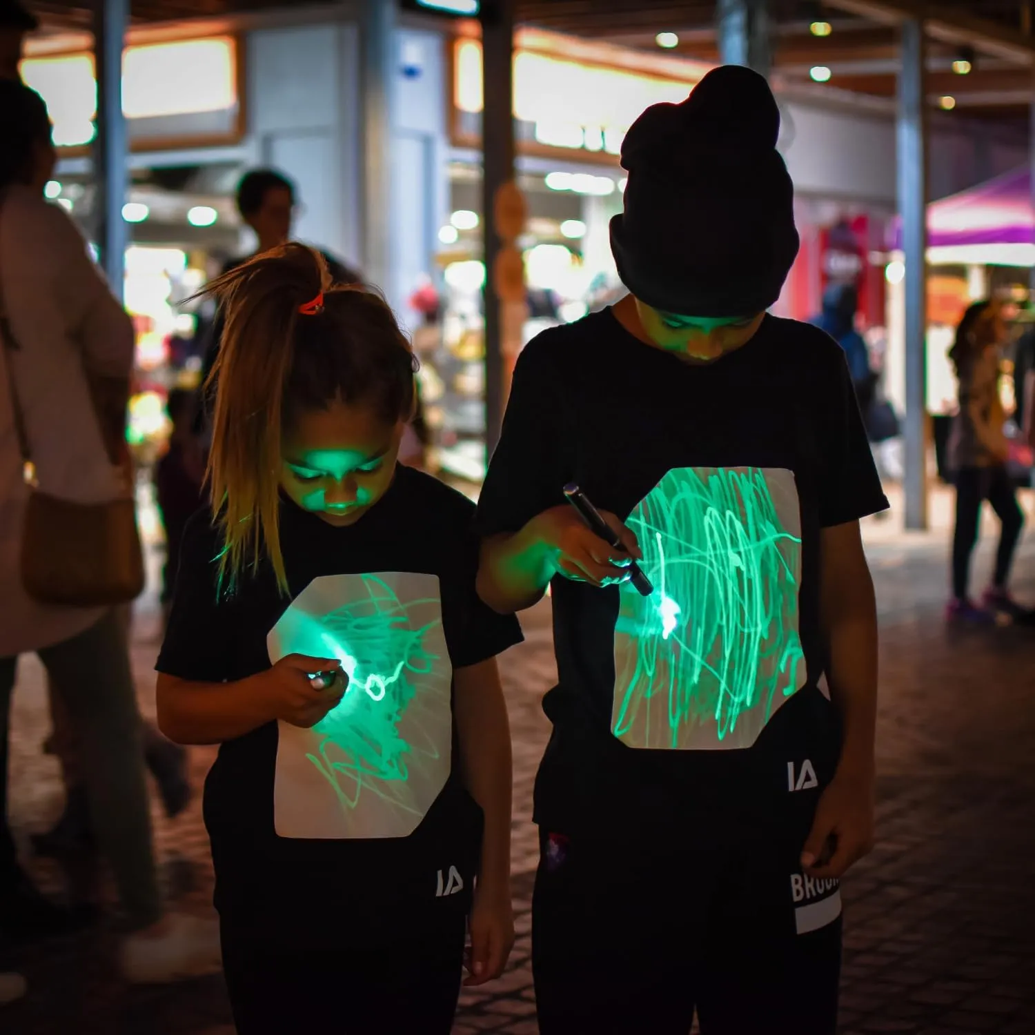 Illuminated Apparel Original Interactive Glow in The Dark T-Shirt - Fun for Birthday Parties & Festivals